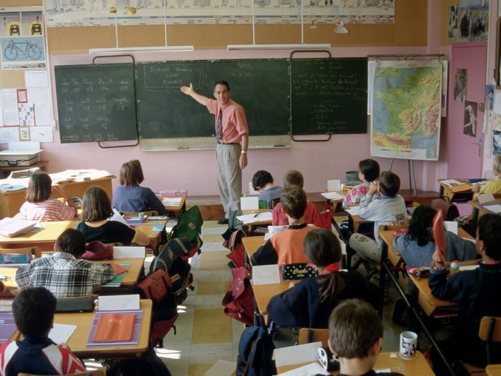 A teacher teaching the class