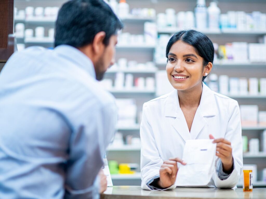 A pharmacist helping someone with the medicine