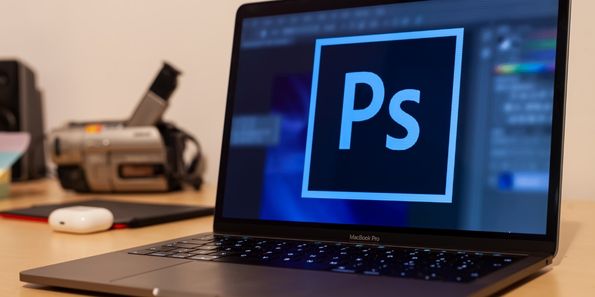 Photoshop logo on computer screen